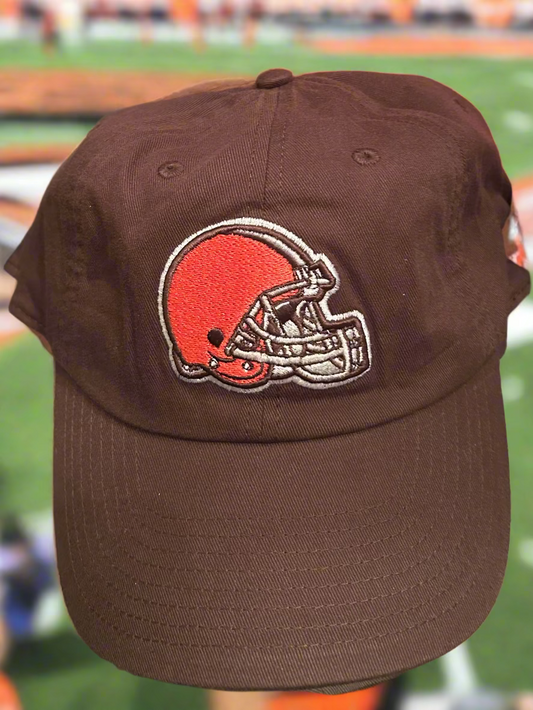 Brown cap with a sports team logo on a blurred stadium background